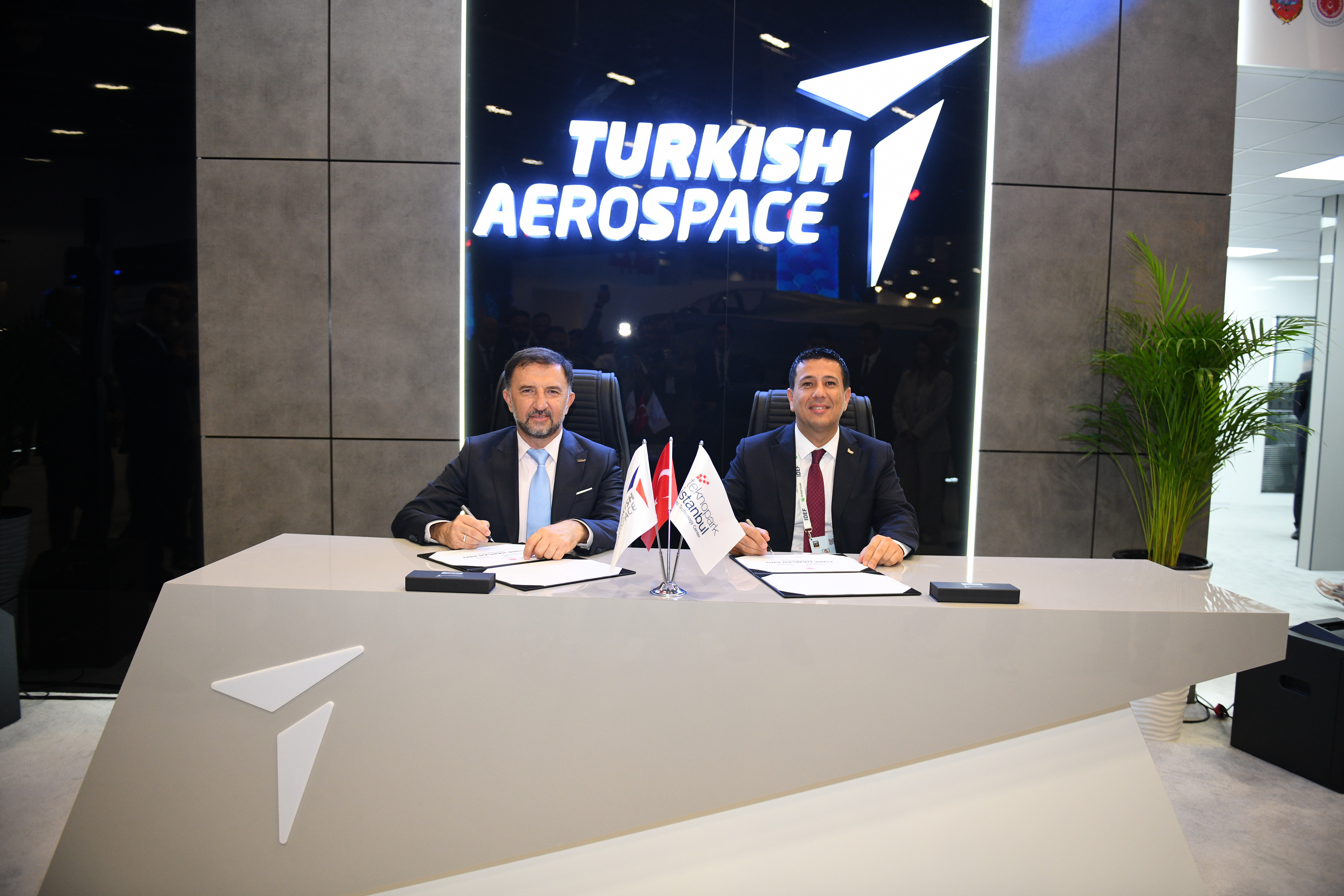 As part of IDEF 2025, the "Cube Hangar Pro Signing Ceremony" was held at the TAI booth, with participation from Teknopark Istanbul General Manager Prof. Dr. Abdurrahman Akyol and TAI General Manager Dr. Mehmet Demiroğlu.
